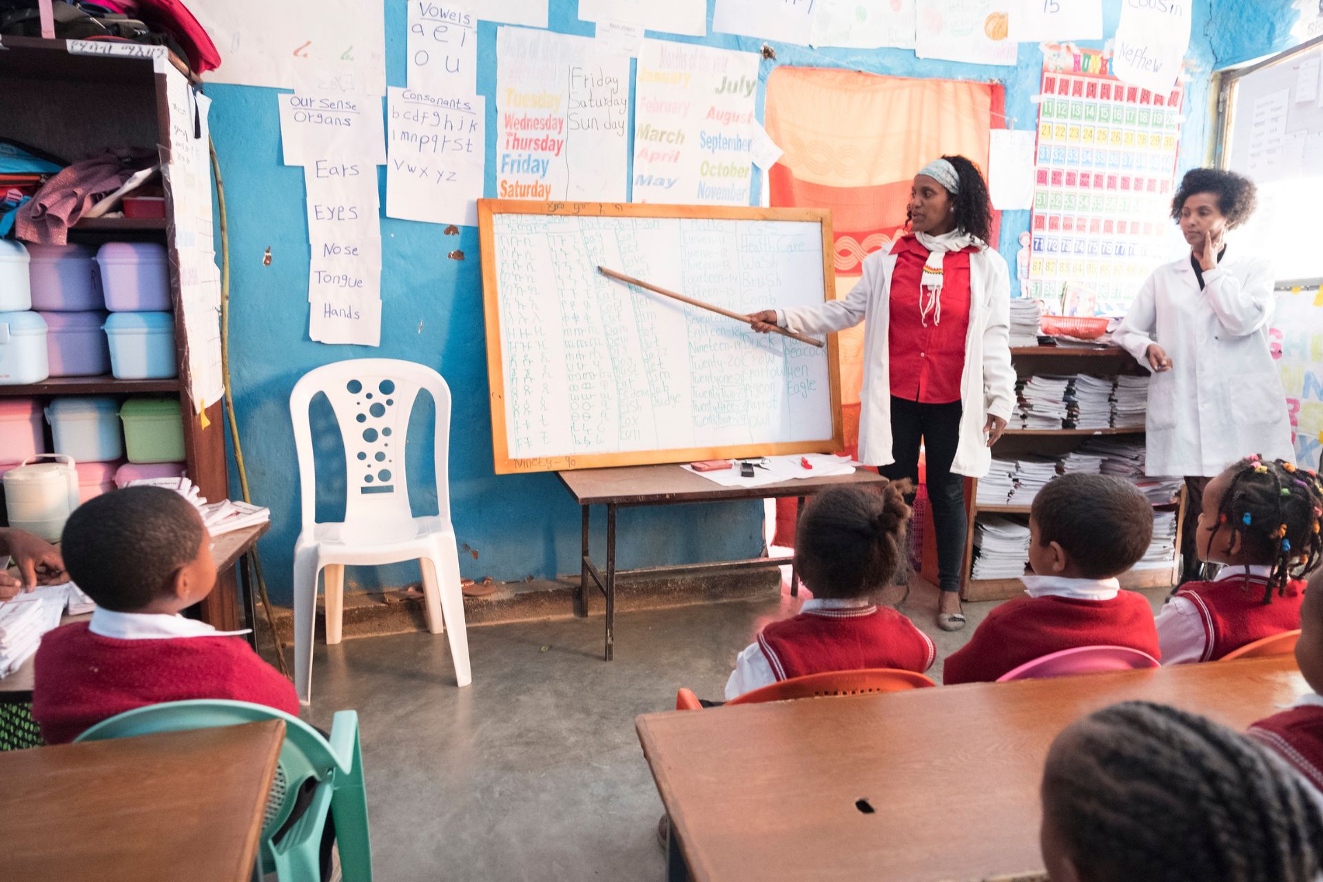 teacher at a whiteboard teaching