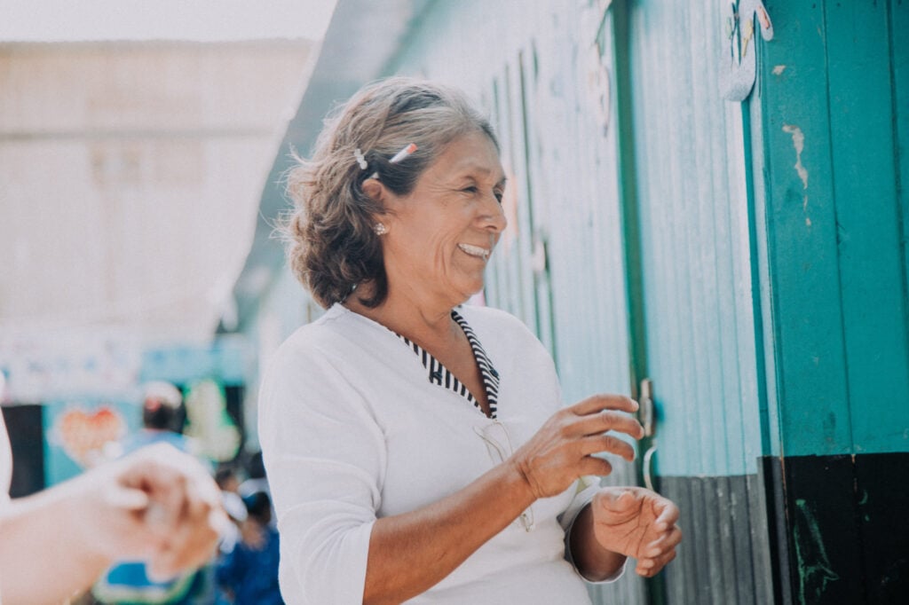 a school proprietor in Peru smiling