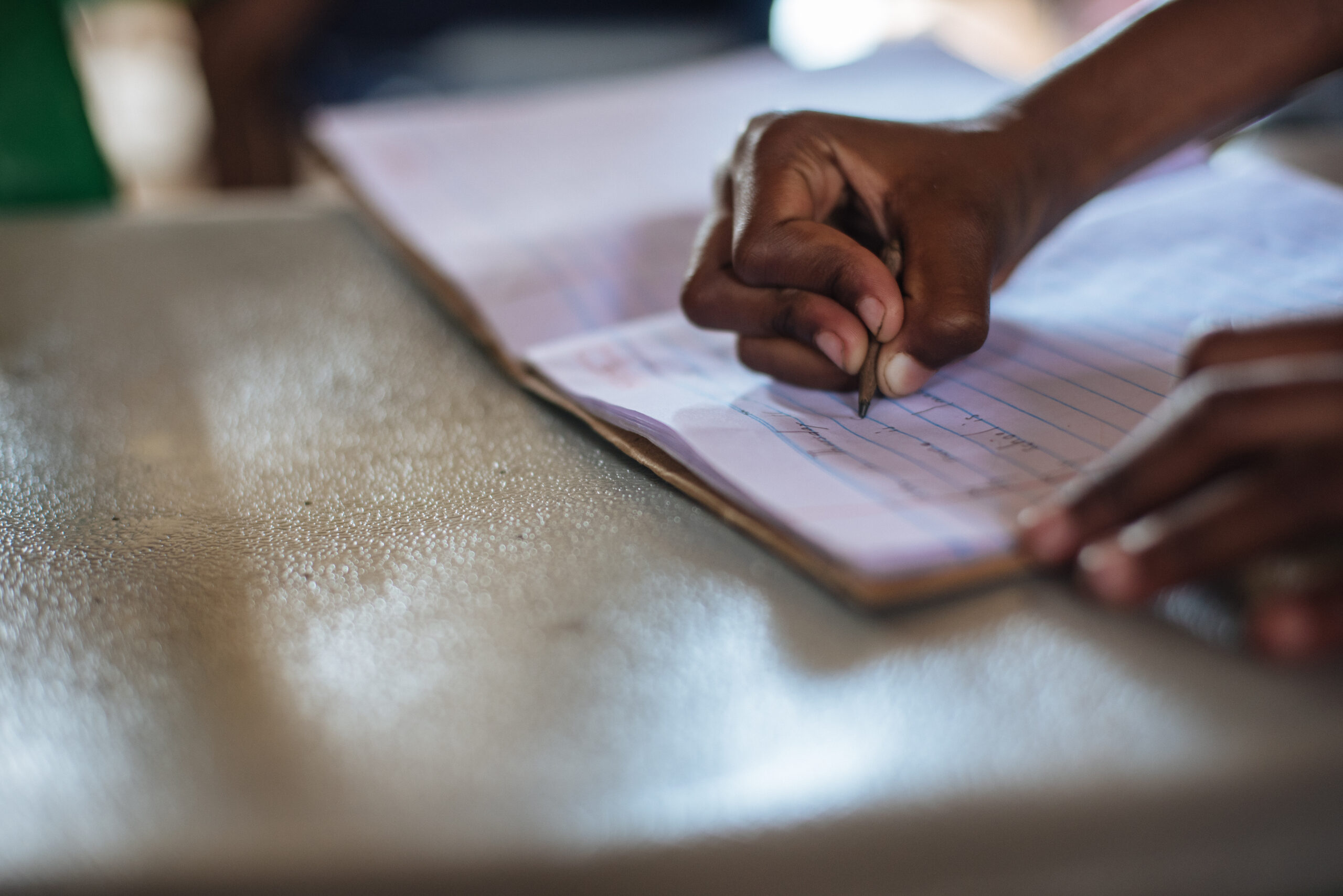 student in uganda doing homework