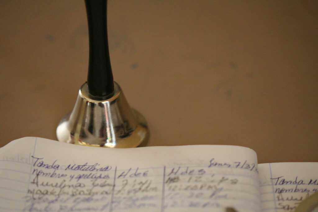 school bell with papers