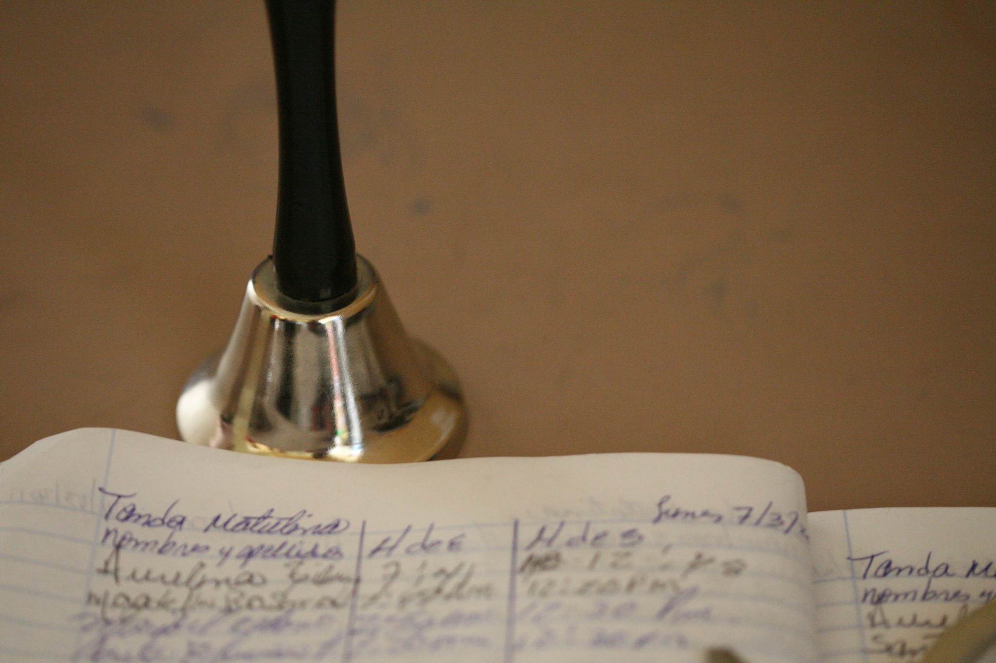 school bell with papers
