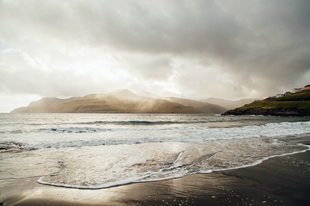 a shoreline with clouds