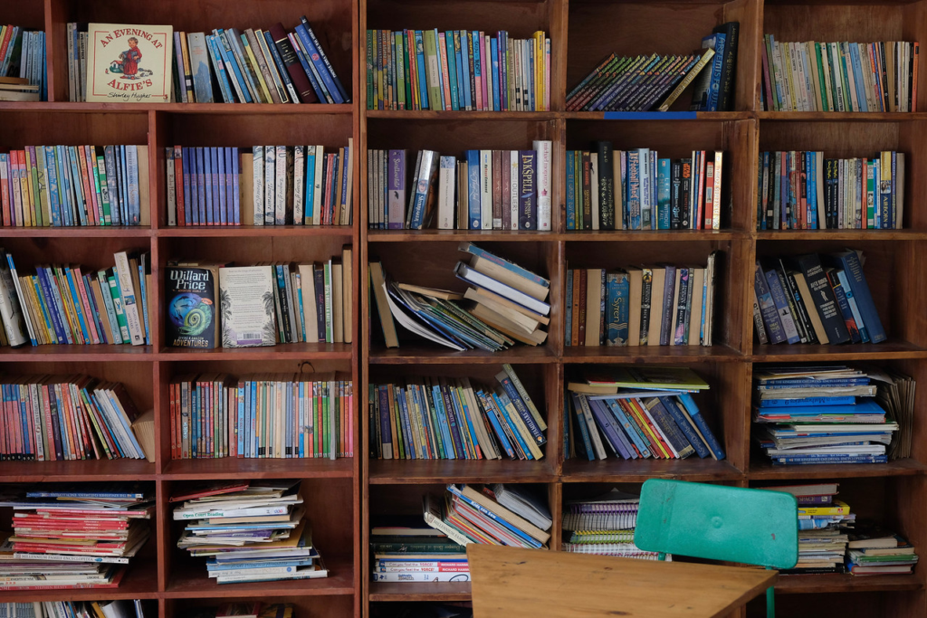 a large bookshelf of colorful books