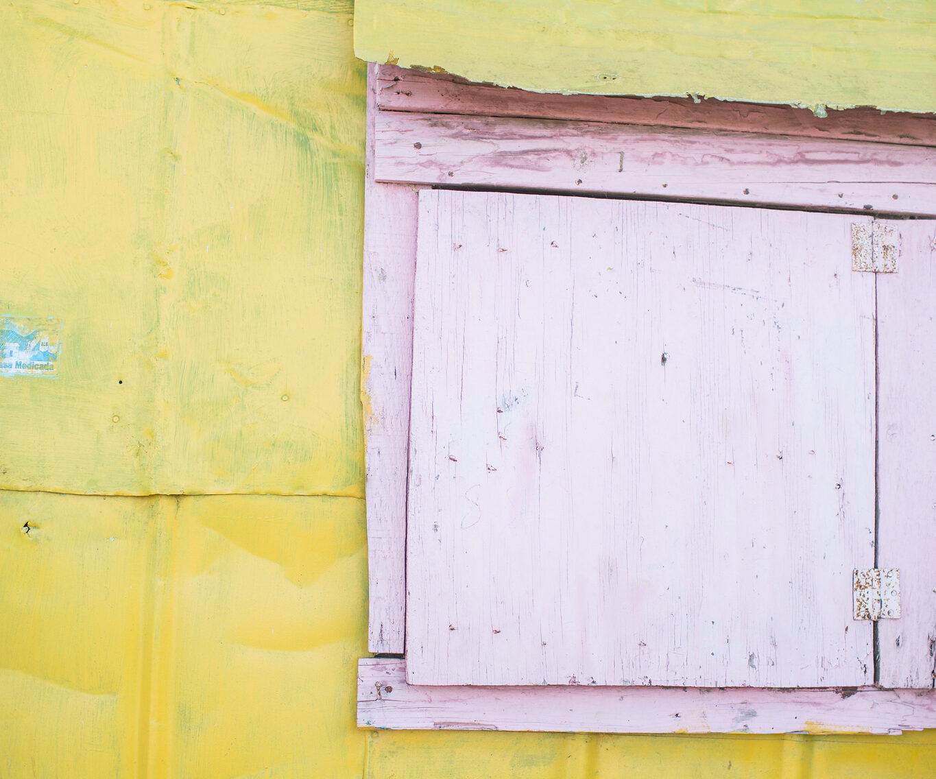 yellow wall with pink door