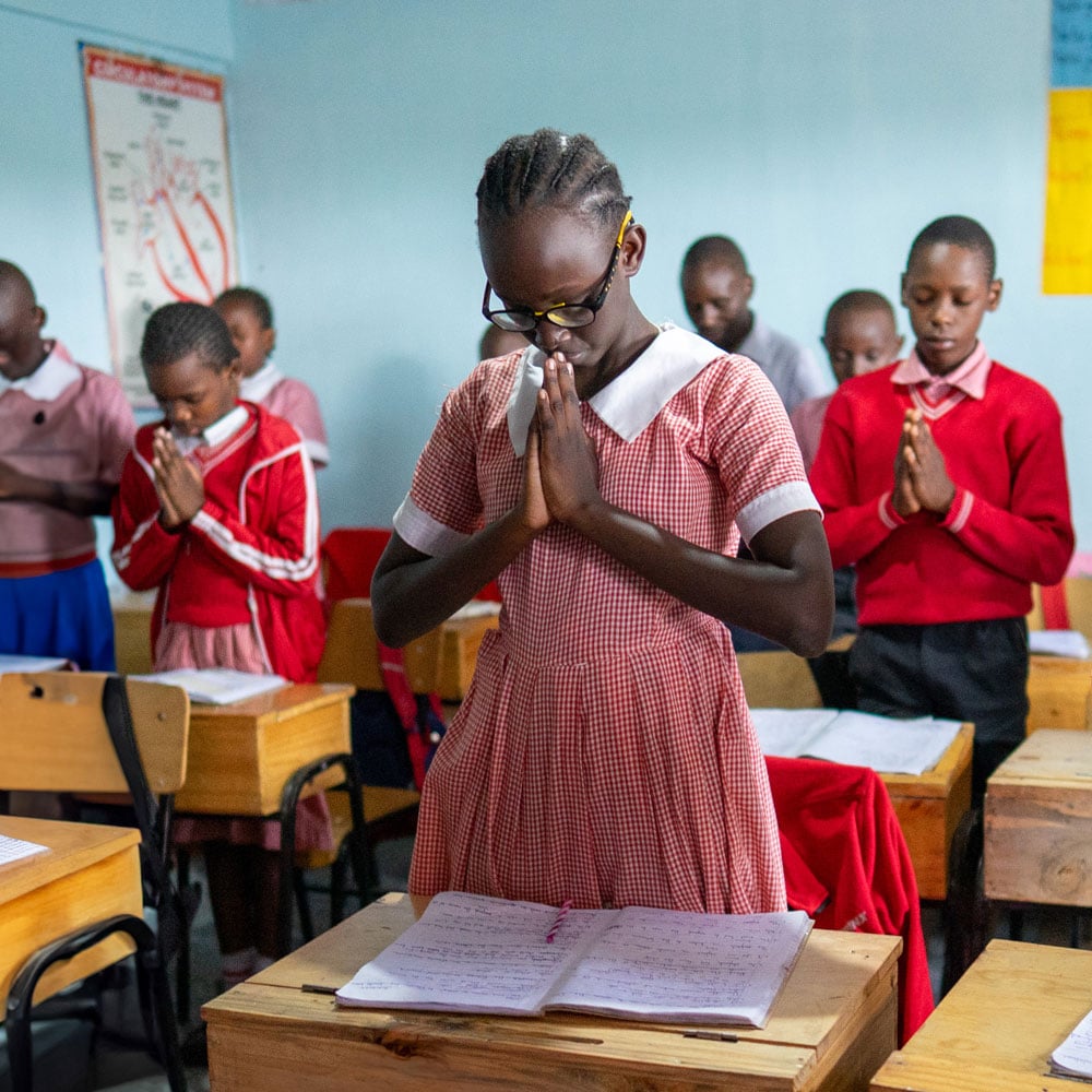 Praying students in Kenya.